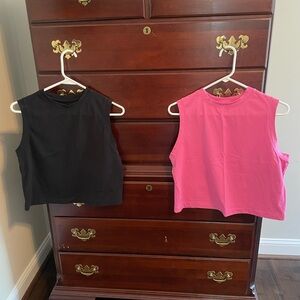 A new day muscle tanks. Black is XS and pink is small but fit similar.
